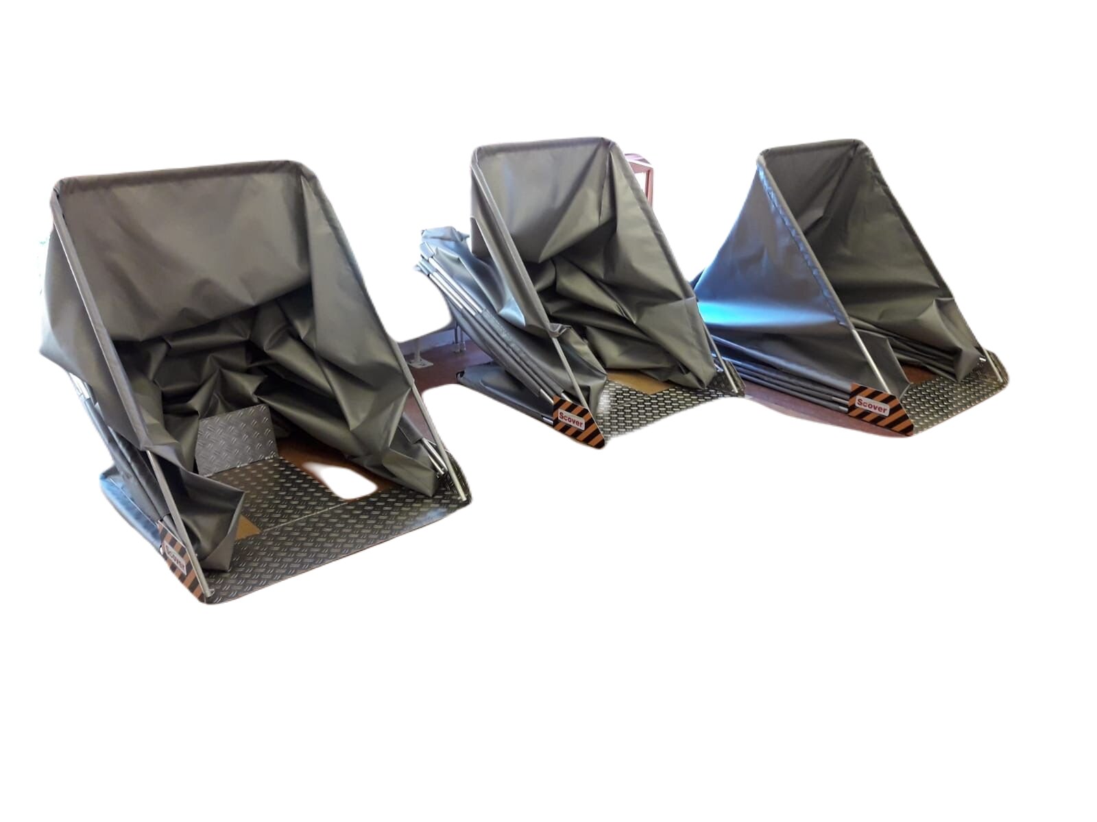 Three opened protective hoods on a steel checker-plate base for a mobility scooter